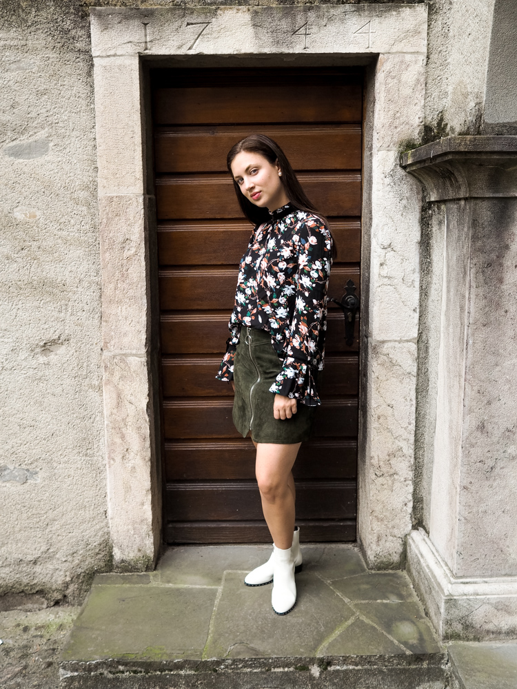 Cristina from The Brunette Nomad, Dallas fashion blogger living in Switzerland, shows how to wear white booties with winter florals