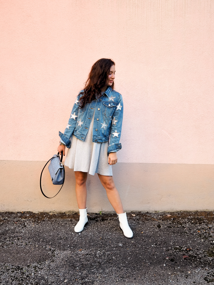 Cristina from The Brunette Nomad, Dallas fashion blogger living in Switzerland, is styling her star printed denim jacket on the blog