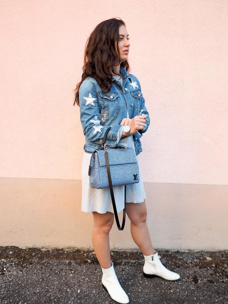 Cristina from The Brunette Nomad, Dallas fashion blogger living in Switzerland, is styling her star printed denim jacket on the blog