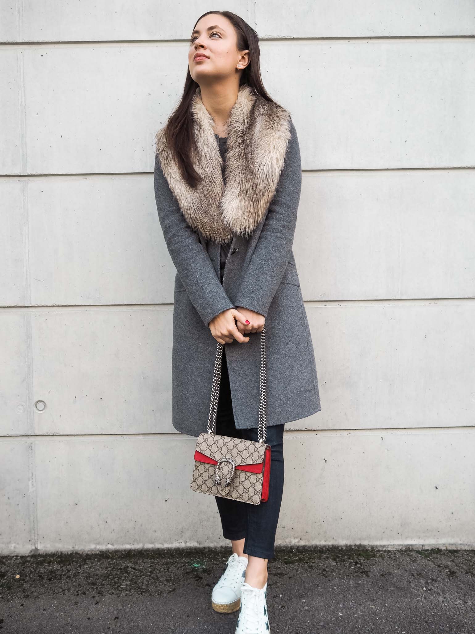 Fashion blogger is wearing a casual weekend style with faux fur