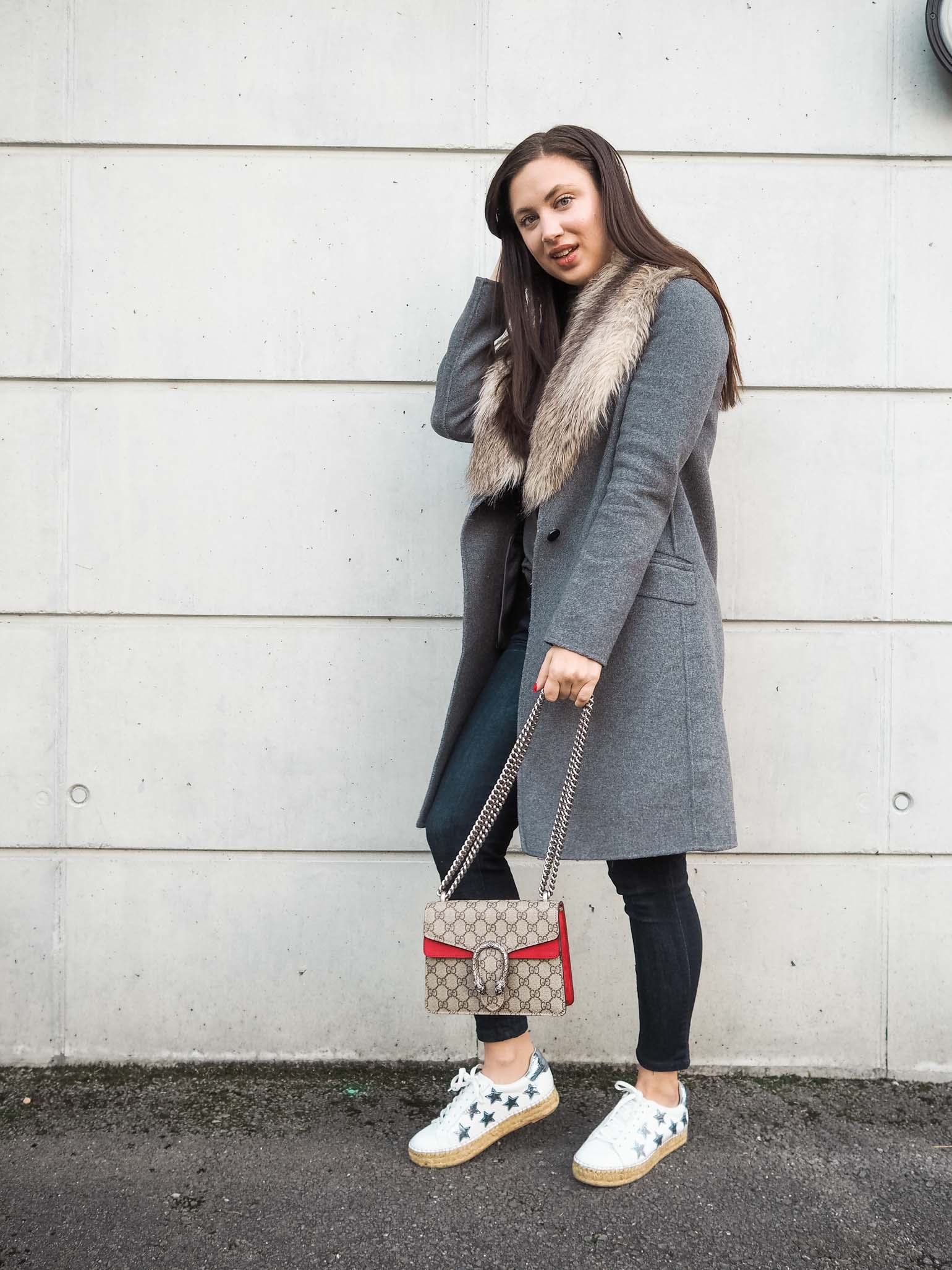 Fashion blogger is wearing a casual weekend style with faux fur