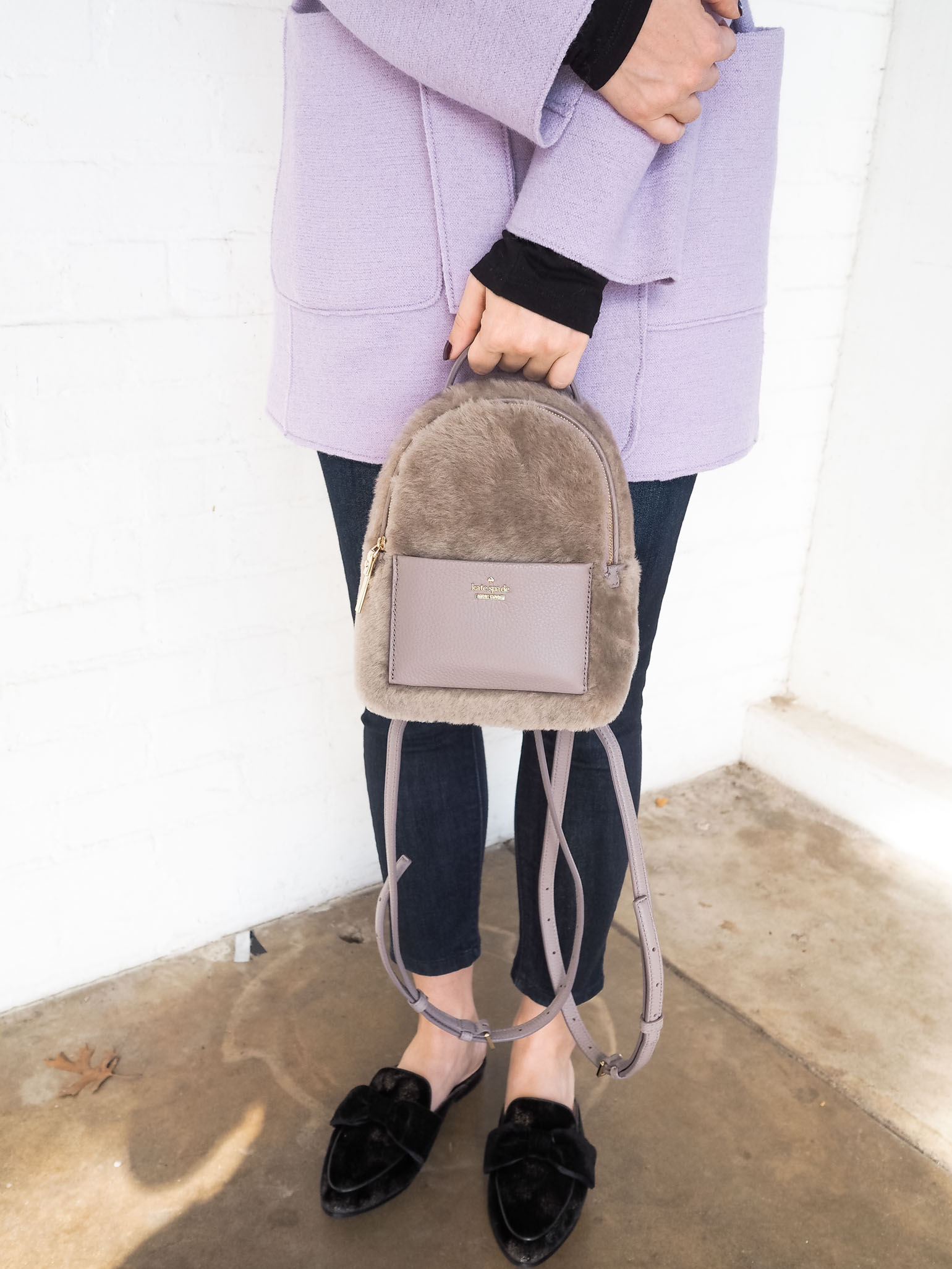 Cristina from The Brunette Nomad, Dallas fashion blogger, shows how to style this Kate Spade mini backpack 